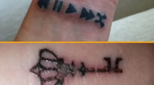Tatuajes mal curados: símbolos de reproducción en la muñeca y una llave descolorida.