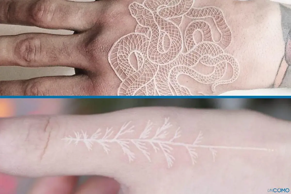 Un delicado tatuaje blanco de serpiente enredada en una mano y una rama de árbol en un dedo.