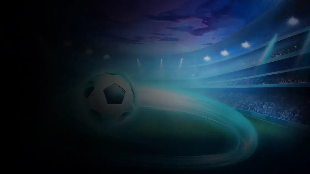Un balón de fútbol vuela en un estadio iluminado, evocando el debate sobre el juego de tiros de penalti: ¿habilidad o azar?